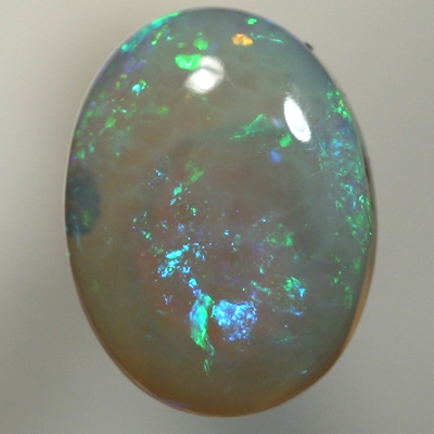 SOLID CRYSTAL OPAL Sparkles of green with orange in a 3D pattern